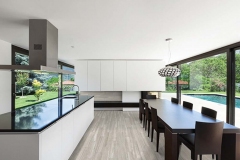 Modern villa, interior, beautiful dining room with kitchen island